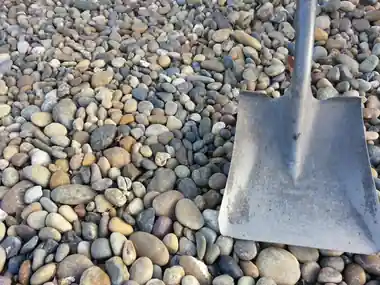 1 1/2 agate round rock with a shovel in the Soracco bin