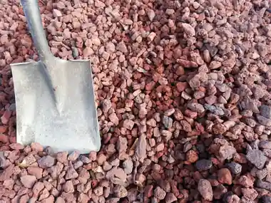 Red lava rock with a shovel