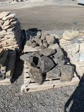 Small basalt rocks on a pallet