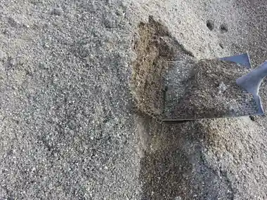 Washed concrete sand on a shovel