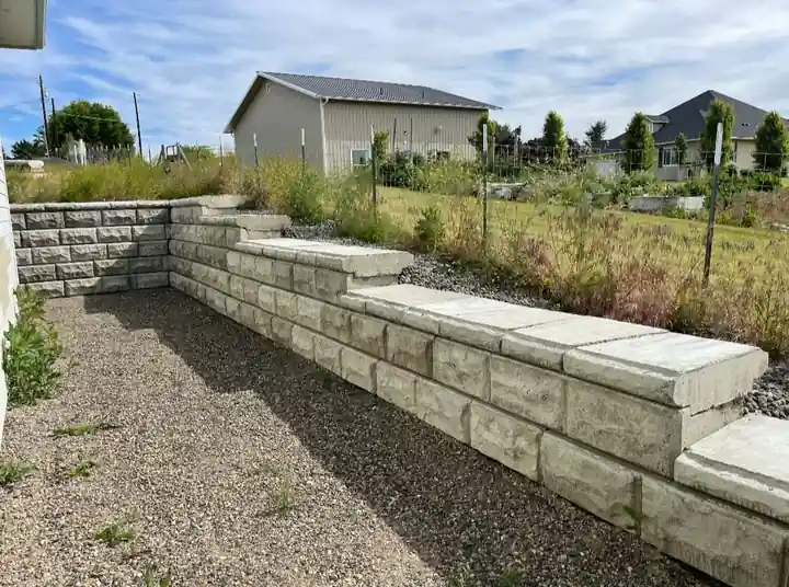 Capped World Block retaining wall on a new-build lot