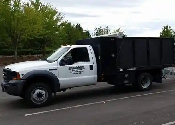 White F-450 dump truck with Soracco door lettering