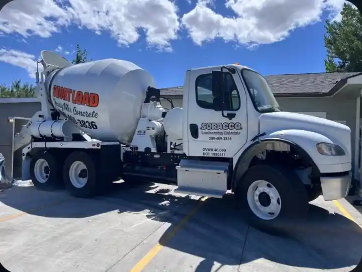 Soracco white Freightliner short-load mixer truck with the yard phone number on the drum